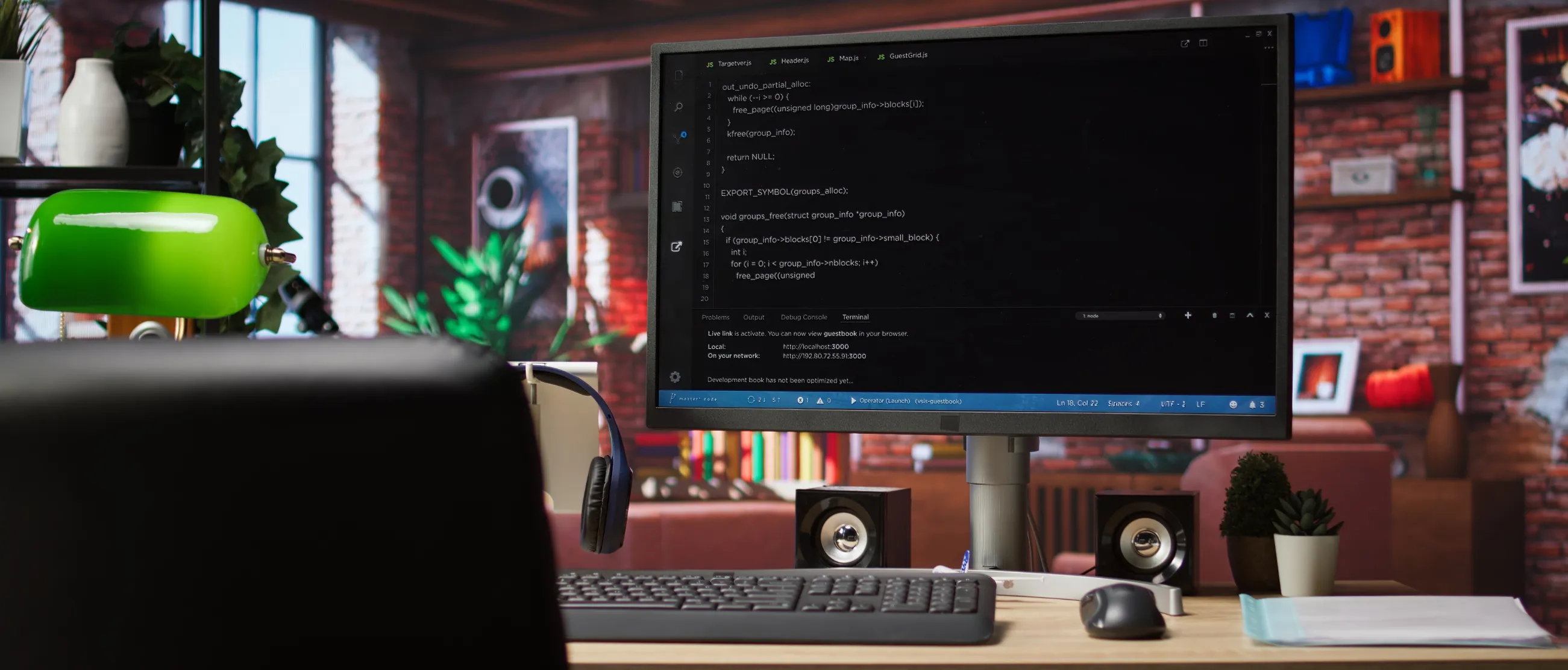 Web development coding on laptop with modern workspace