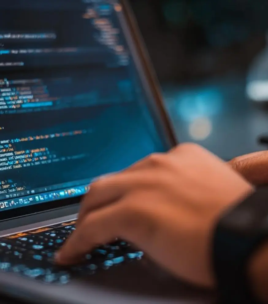 Programming code displayed on a laptop screen
